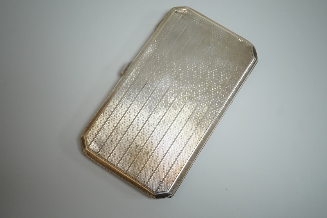 A George V silver rectangular cigarette case, with canted corners, Henry Matthews, Birmingham, 1926, 14.3cm, 6oz.